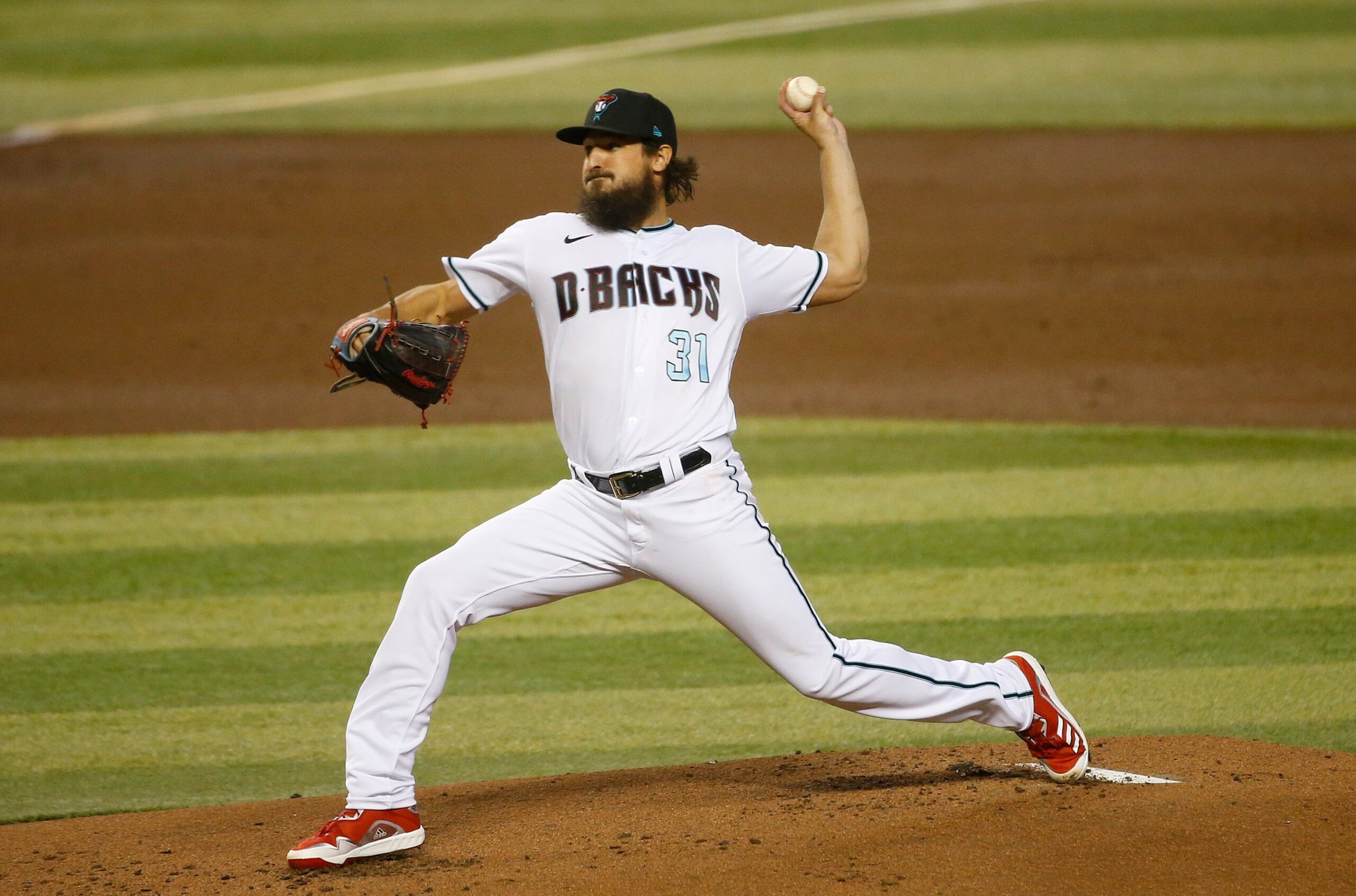 Diamondbacks pitcher Caleb Smith throws from the mound.